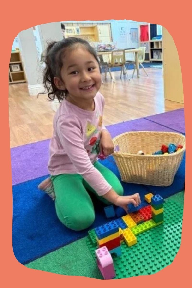 3 years old girl playing with lego at kids konnect preschool