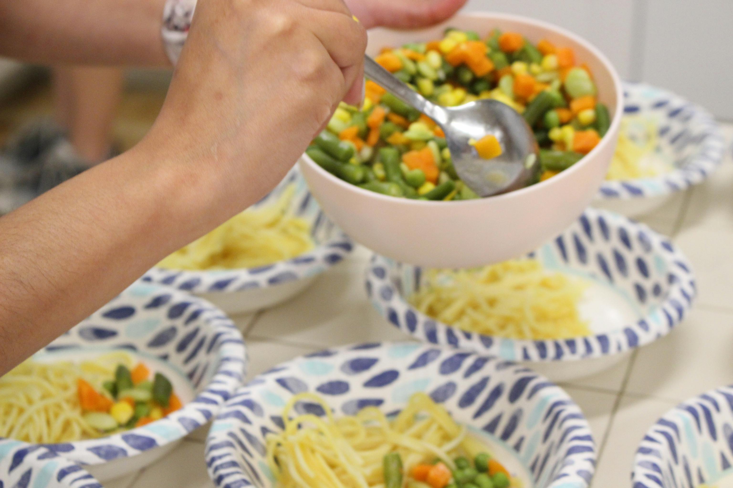 Nutritious preschool lunch being served with veggies and pasta at Kids Konnect San Mateo