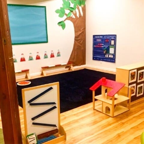 Organized preschool classroom with educational toys and wall learning materials at Kids Konnect