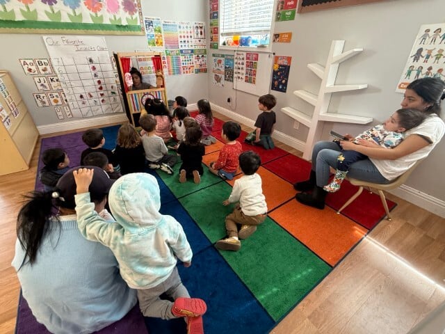 Kids Konnect preschoolers in circle time with two teachers supporting diverse learners