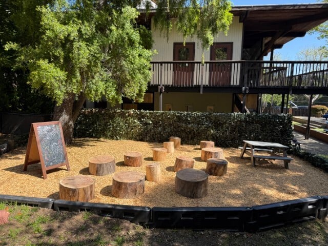 Our beautiful outdoor classroom with wooden logs